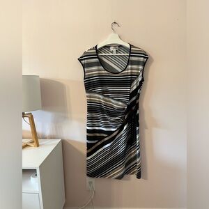 Slip on dress with tie waist.